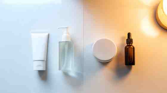 Split flat lay: morning skincare with sunscreen in daylight on the left, evening night cream in warm lamplight on the right