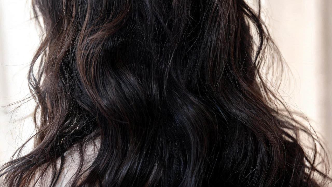 Soft, natural K-drama-style waves in dark hair