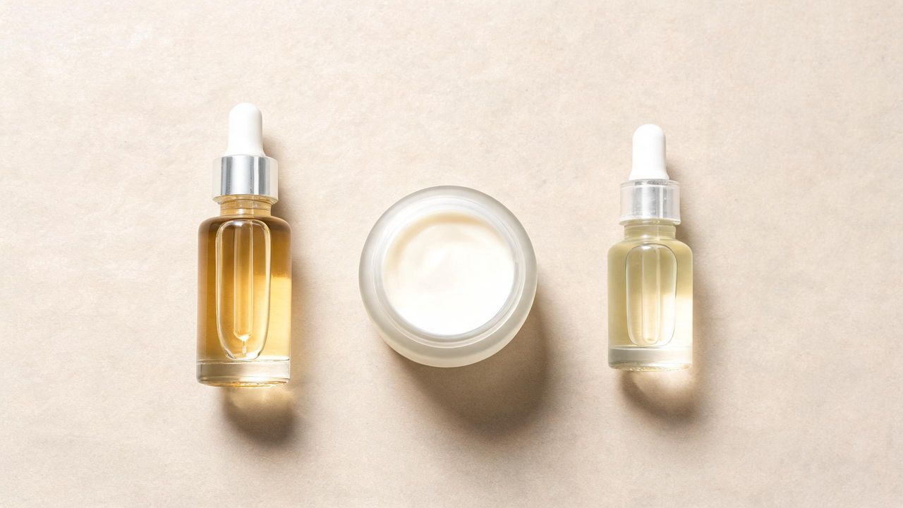 Korean retinol-alternative products including bakuchiol serum, peptide cream, and low-percentage retinol on a neutral surface